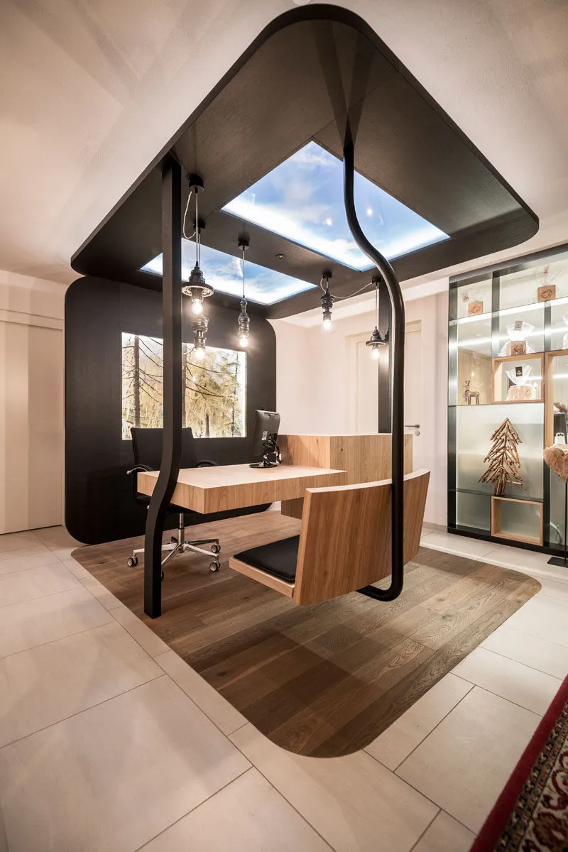 A modern office space featuring wooden furnishings and a unique, open-air design.