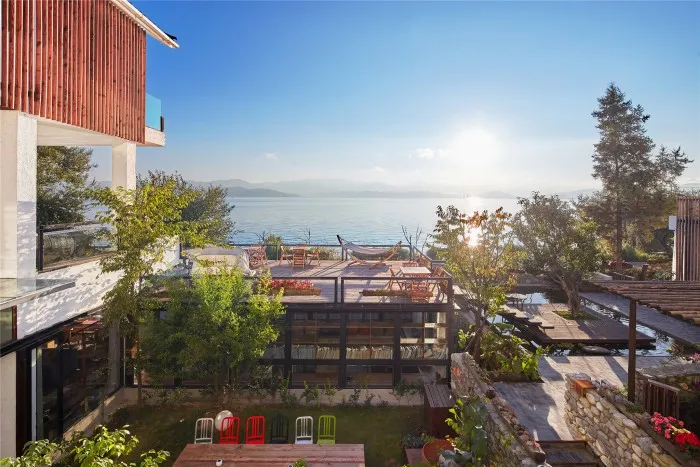 Modern vacation home with ocean view and wooden exterior.