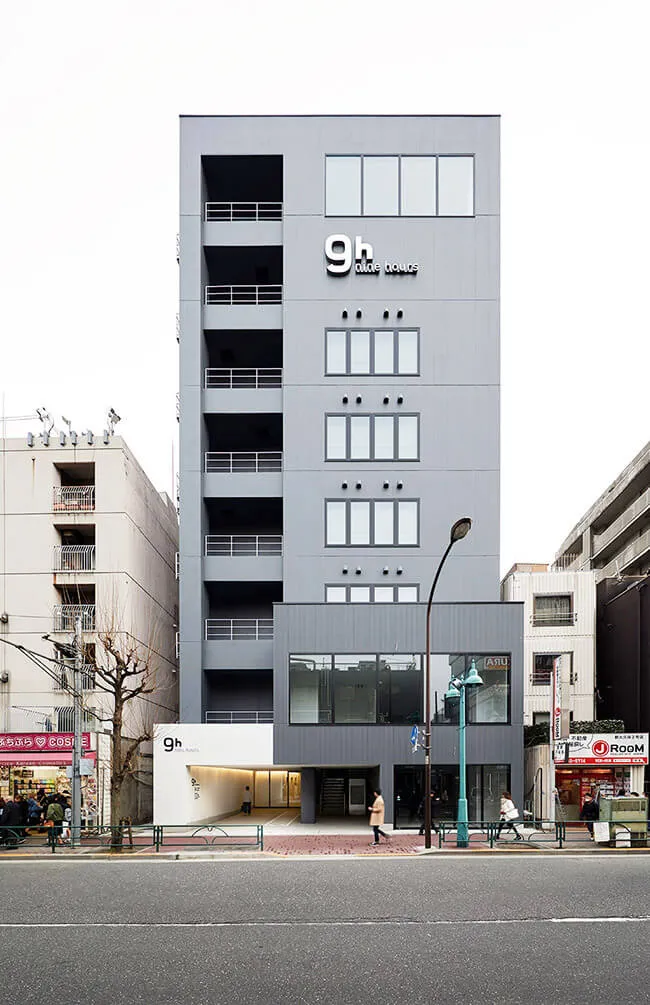 Modern gray concrete building with a minimalist design.