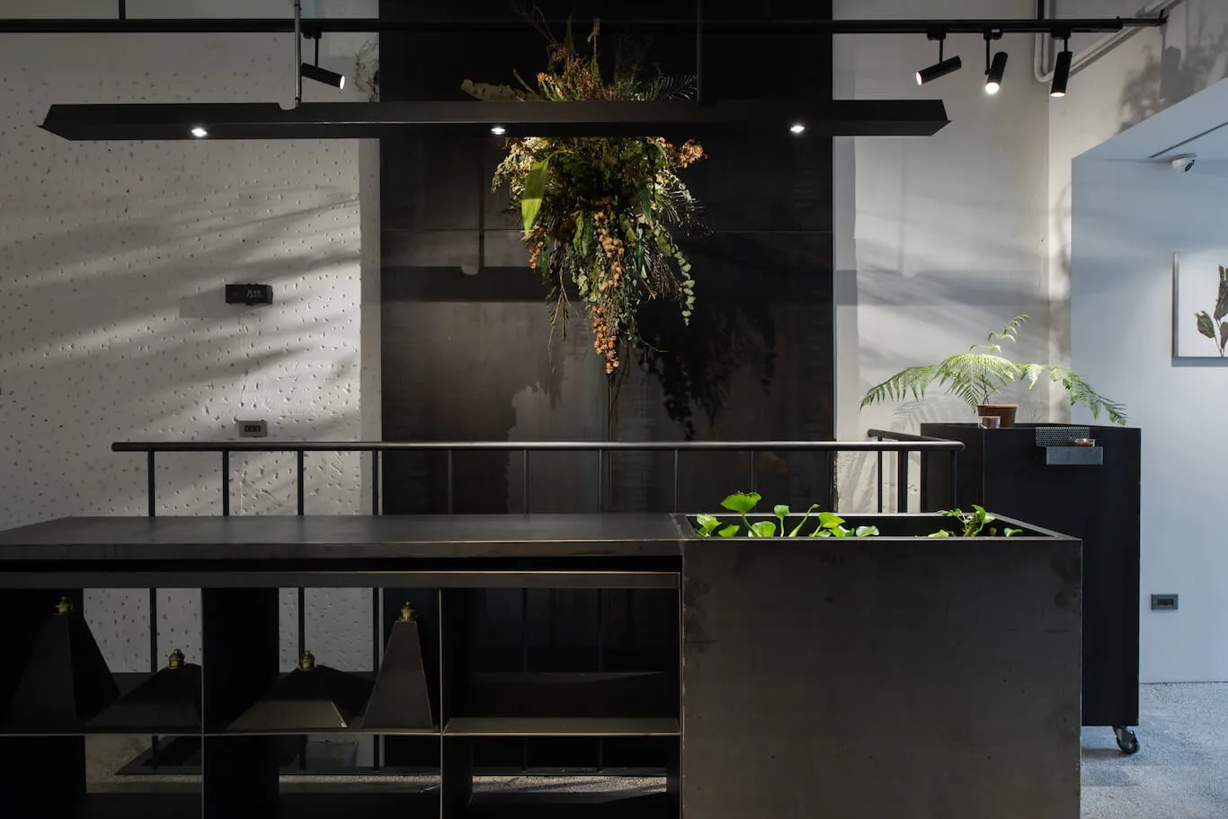 An industrial-style office space featuring metal and concrete materials.
