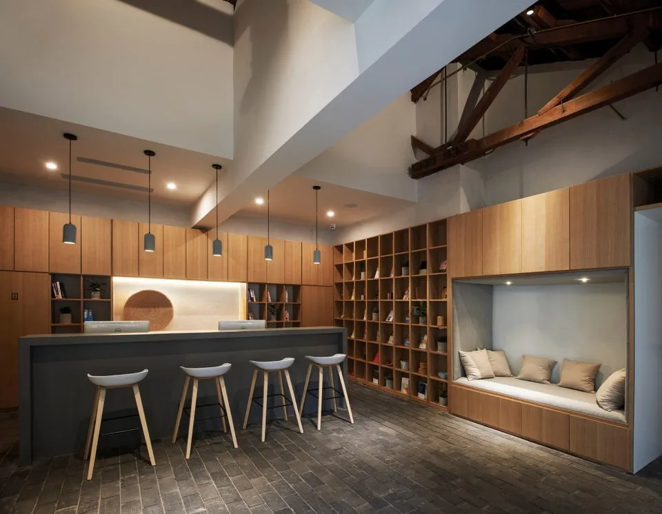 Modern cafe bar with wooden furniture and bar stools.