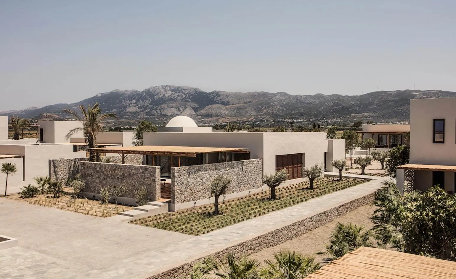 Modern residential architecture showcasing concrete and stone materials.
