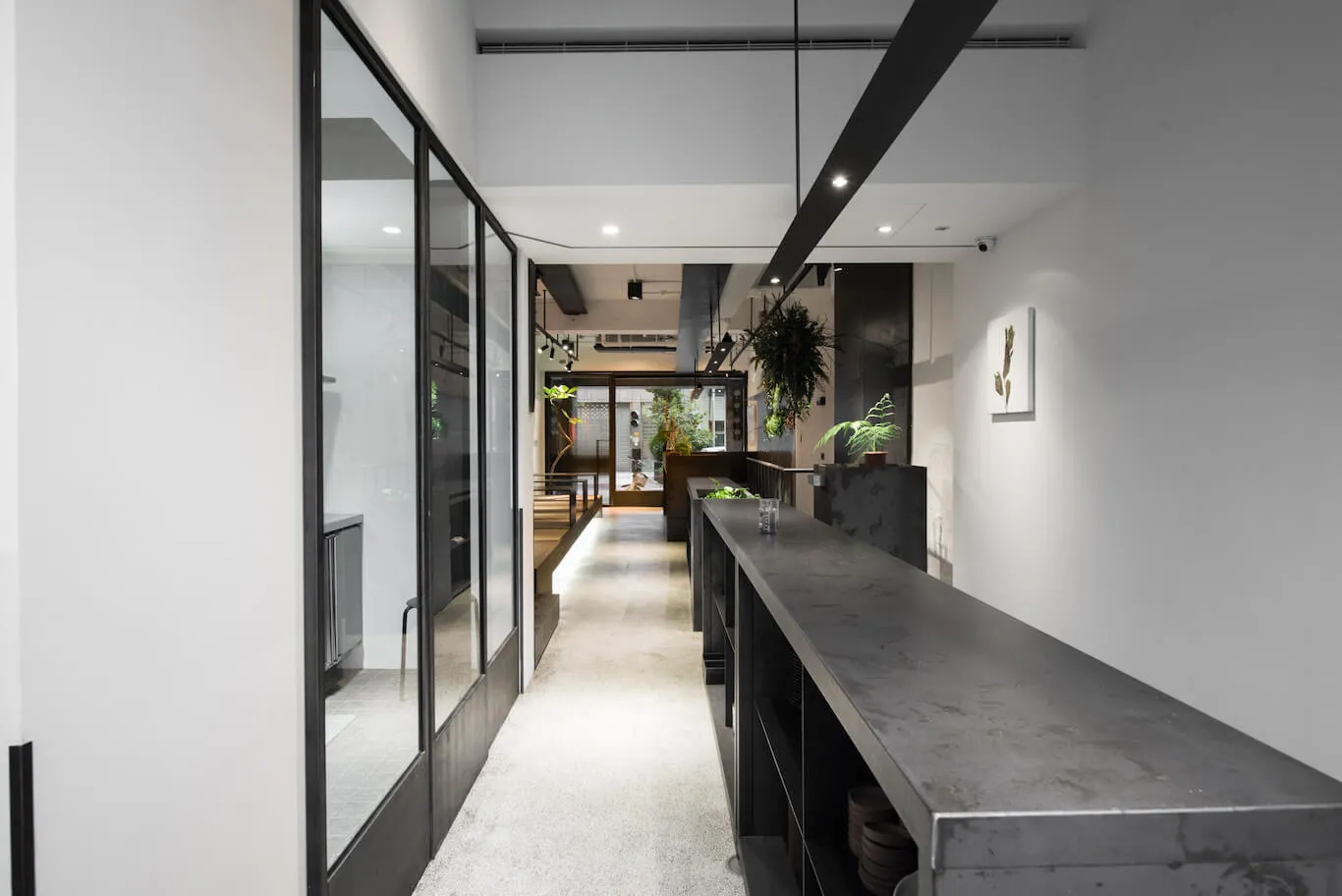 A modern commercial interior showcasing a concrete counter with a minimalist design.