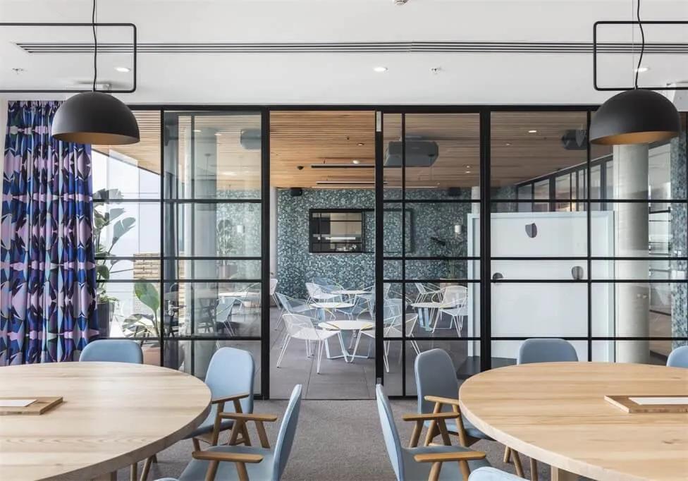 Modernly designed office conference room featuring glass and steel materials.