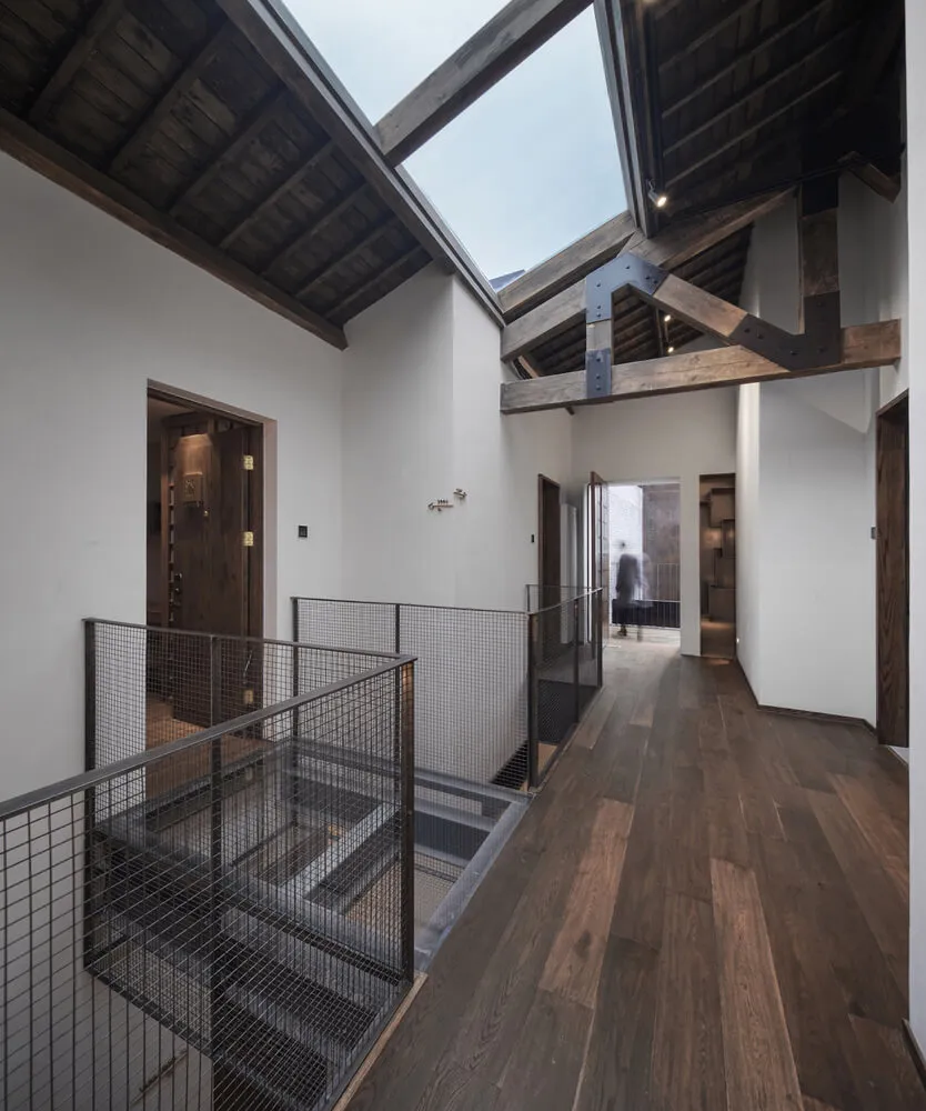 Industrial-style architecture with wooden materials and open ceiling beams.