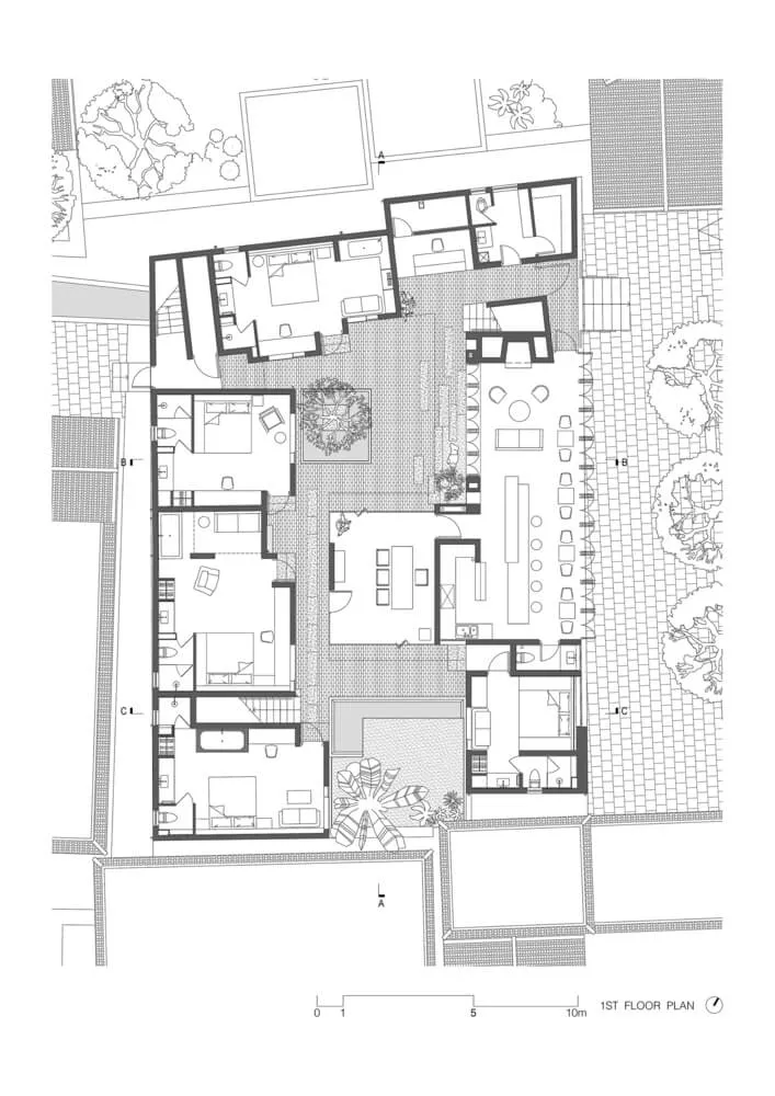 Floor plan of a modern residential building with brick and plaster exterior