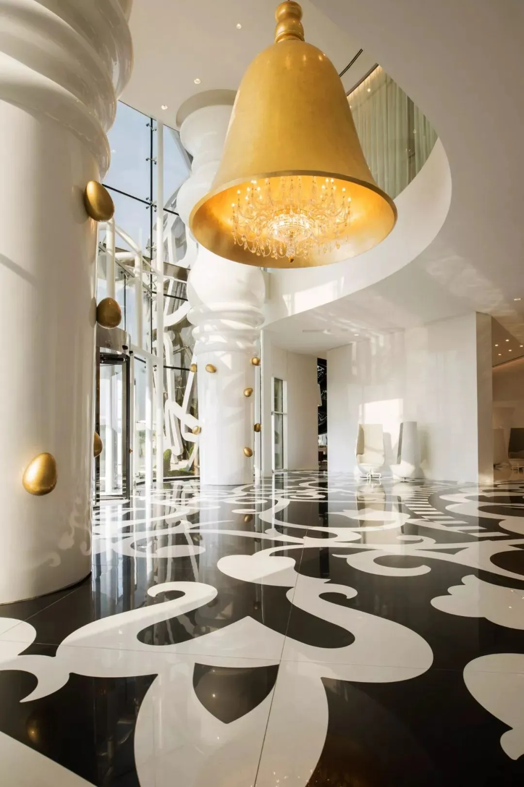 Modern lobby with white concrete pillars and decorative flooring