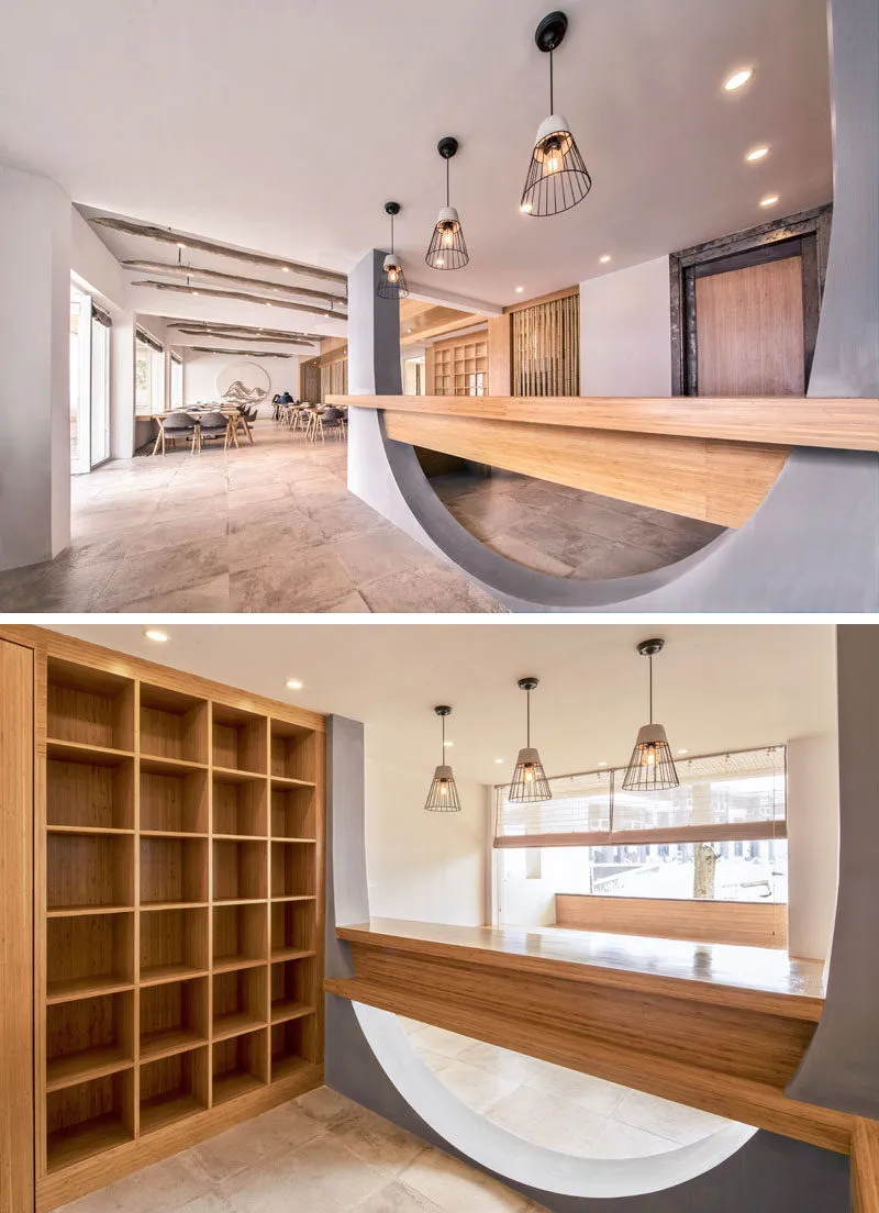 Lobby area of a modern restaurant with concrete materials and minimalist design