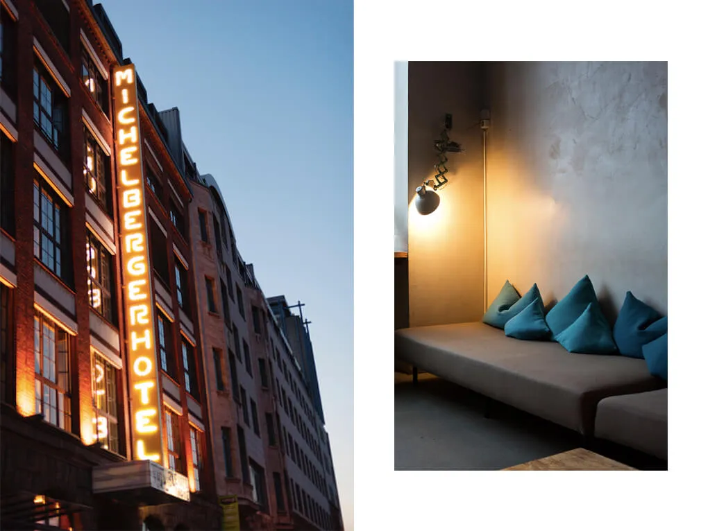 Modern hotel lobby with illuminated signage and cozy seating area.