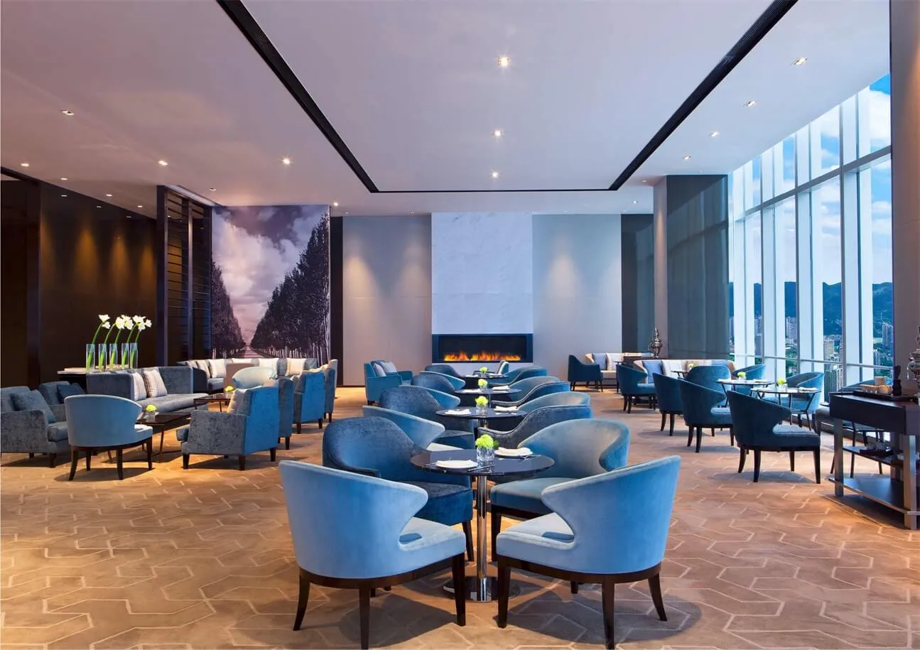 Modern restaurant interior design with fabric seats and tables.