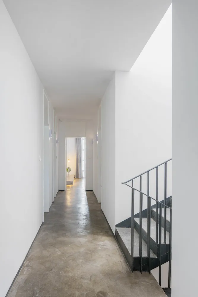 Modern interior design featuring concrete walls and minimalist furniture.