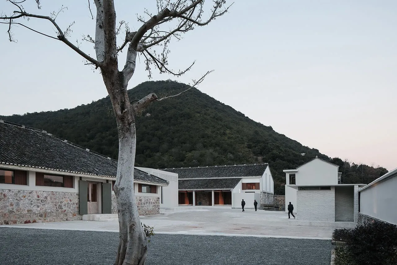 A modern residential building made of stone and cement.