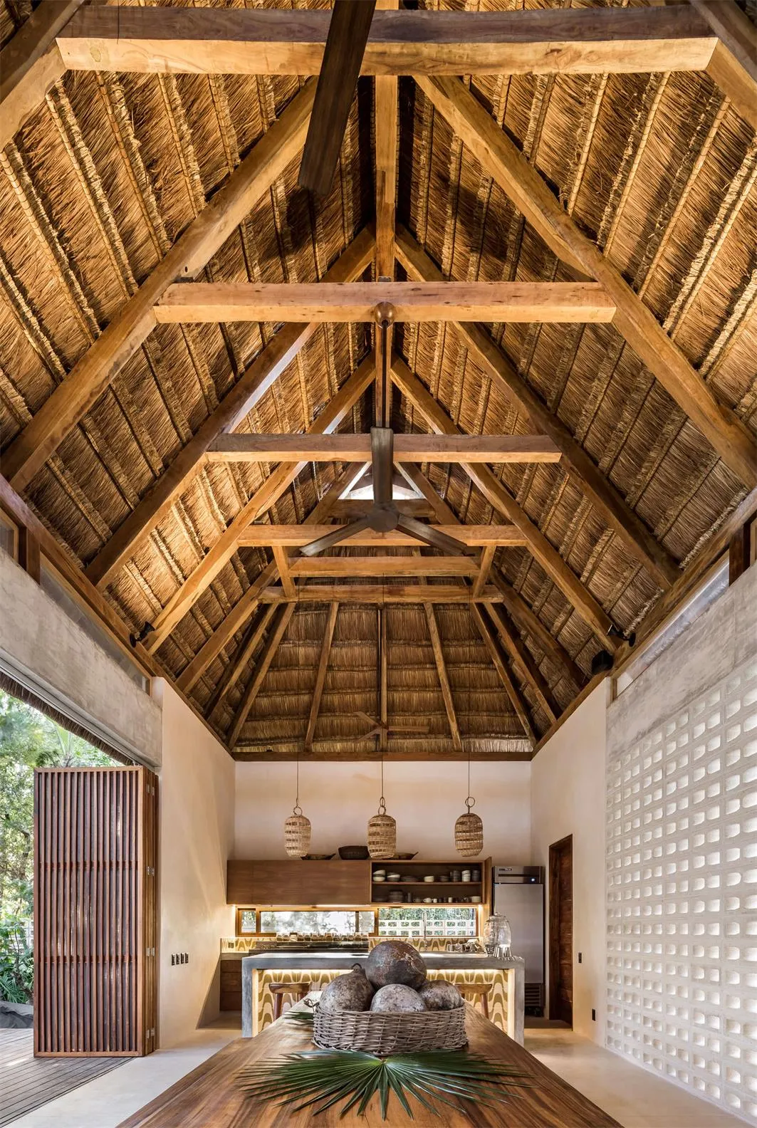 Industrial-style kitchen with wooden ceiling and open-concept design.