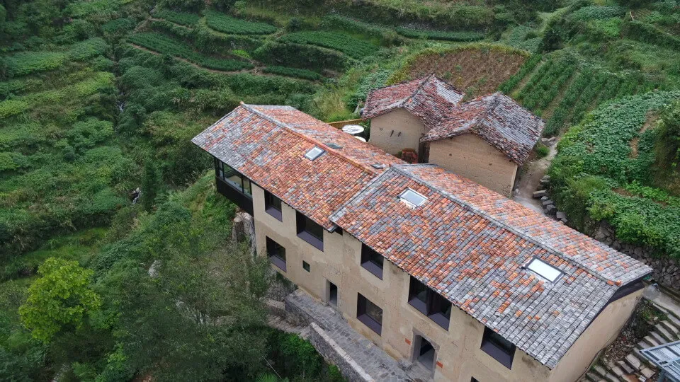 Aerial view of a modern residential building with brick exterior.