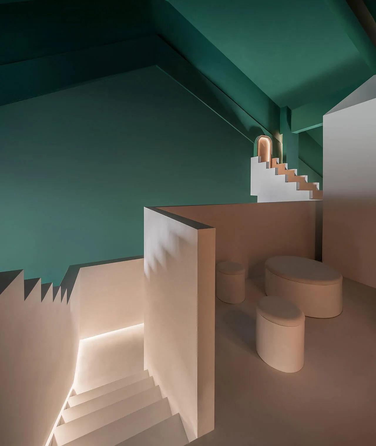 Modern interior space with concrete walls, floors, and lamp, featuring geometric shapes and minimalist design.