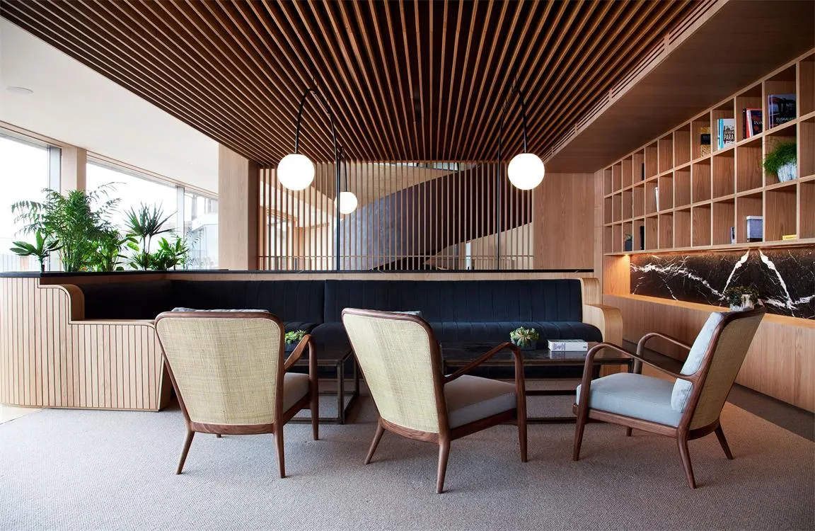 An image of a modern office space featuring wooden paneled walls.