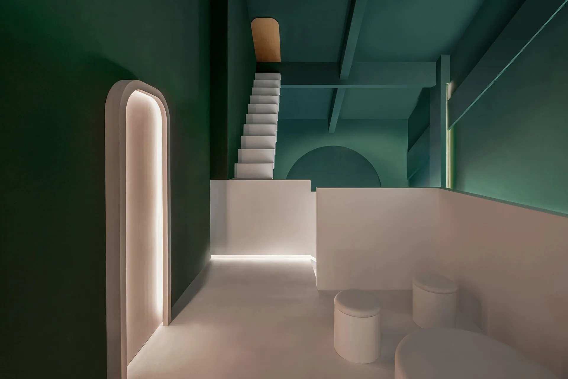 Modern interior with green walls and white staircase