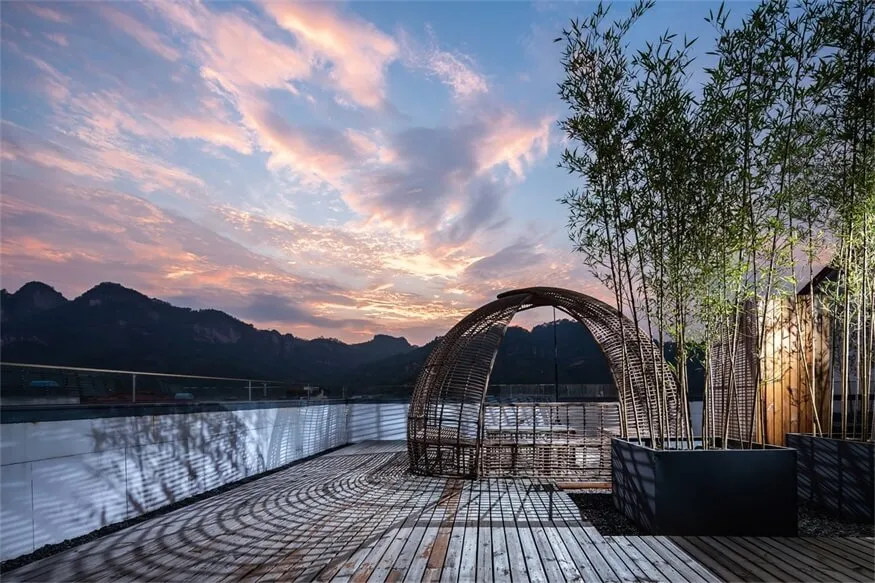 A minimalist outdoor space featuring bamboo and wooden materials.