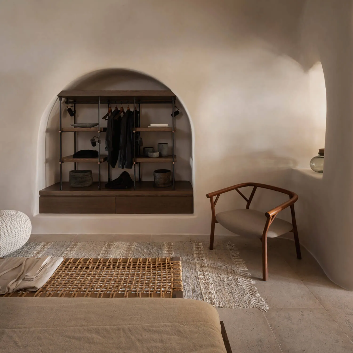 Modern, minimalist residential interior featuring neutral tones and a cozy atmosphere.
