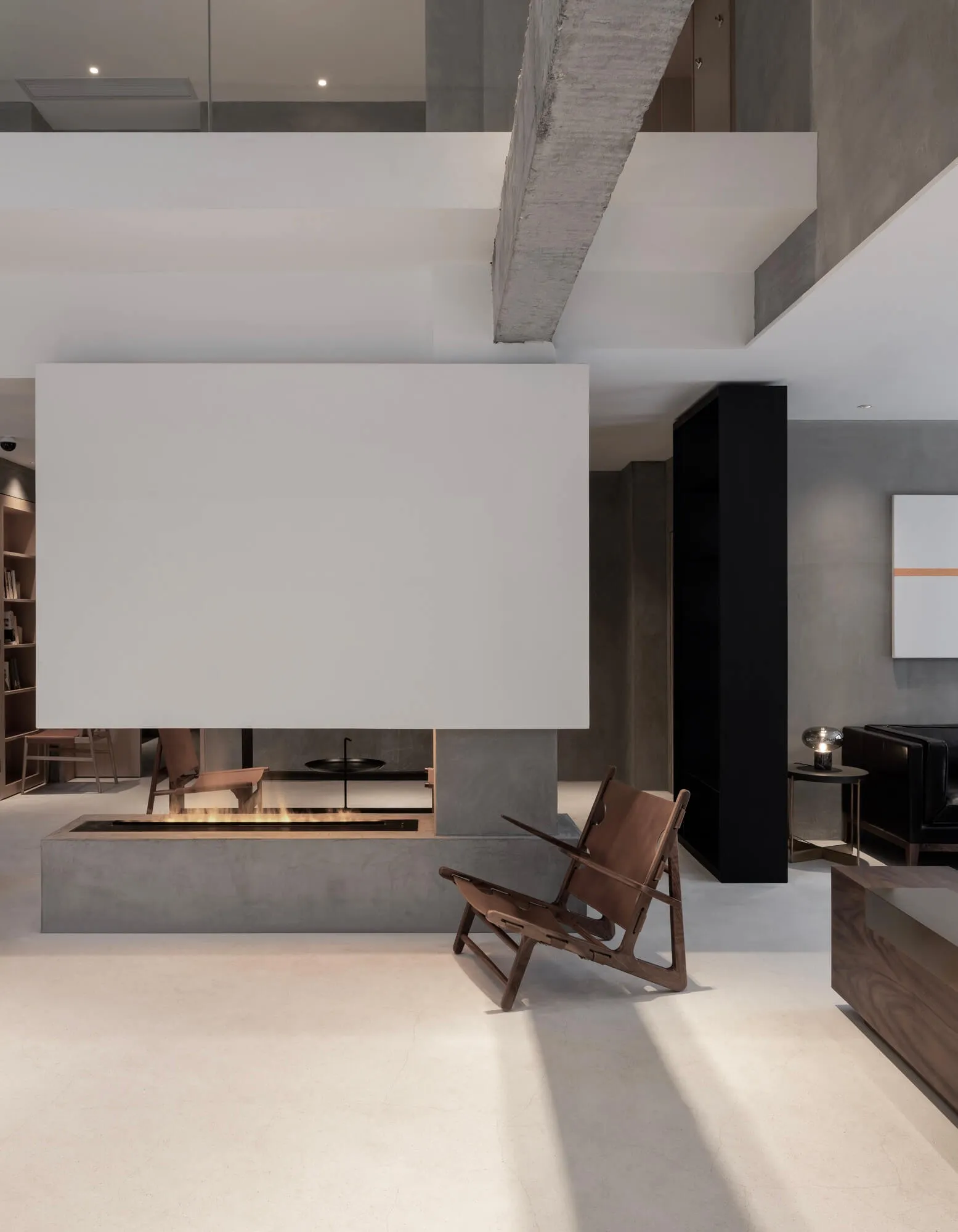 Modern lounge area with concrete elements and a minimalist design.