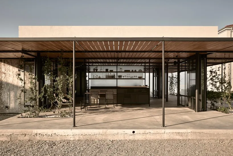 A modern residential space featuring a concrete floor and minimalist design.