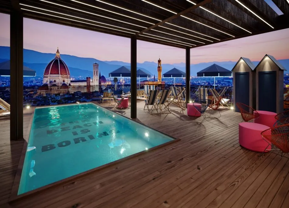 Modern rooftop pool with wooden deck and cityscape view