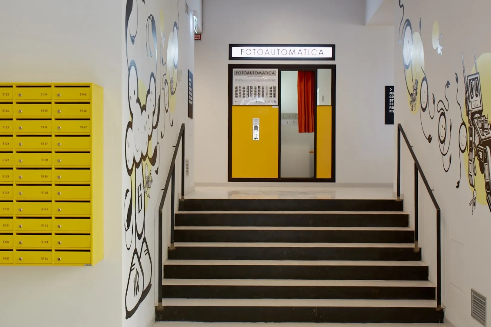 A photograph studio with concrete and glass walls