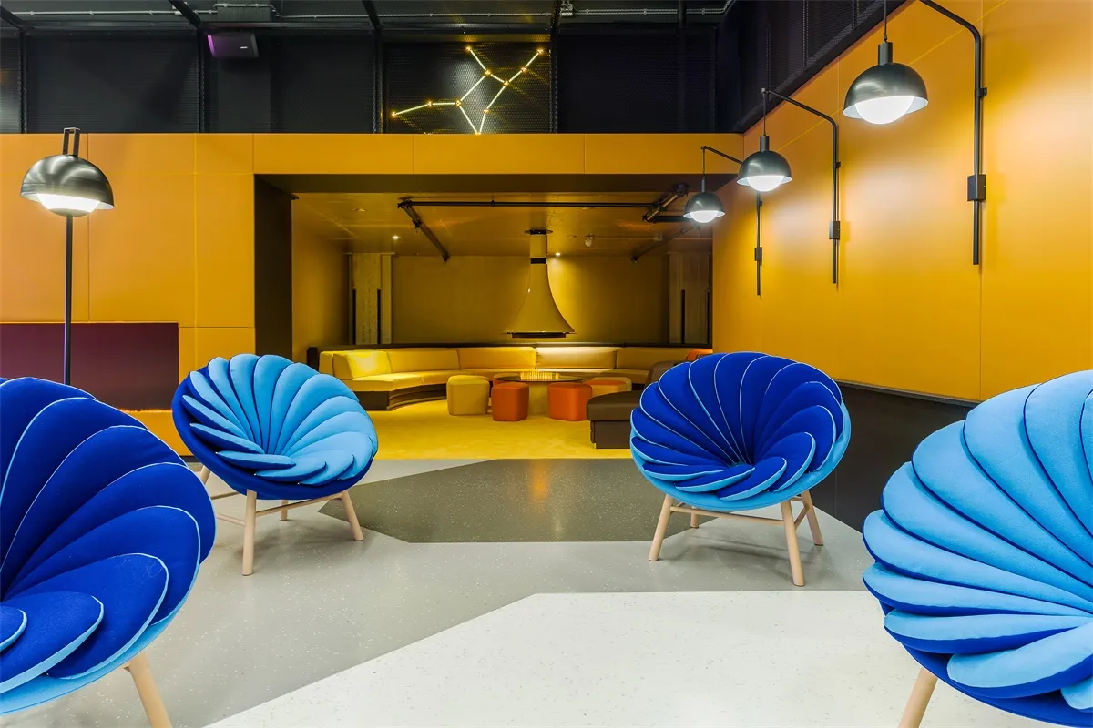 A modern industrial office space featuring textured fabric and concrete materials.