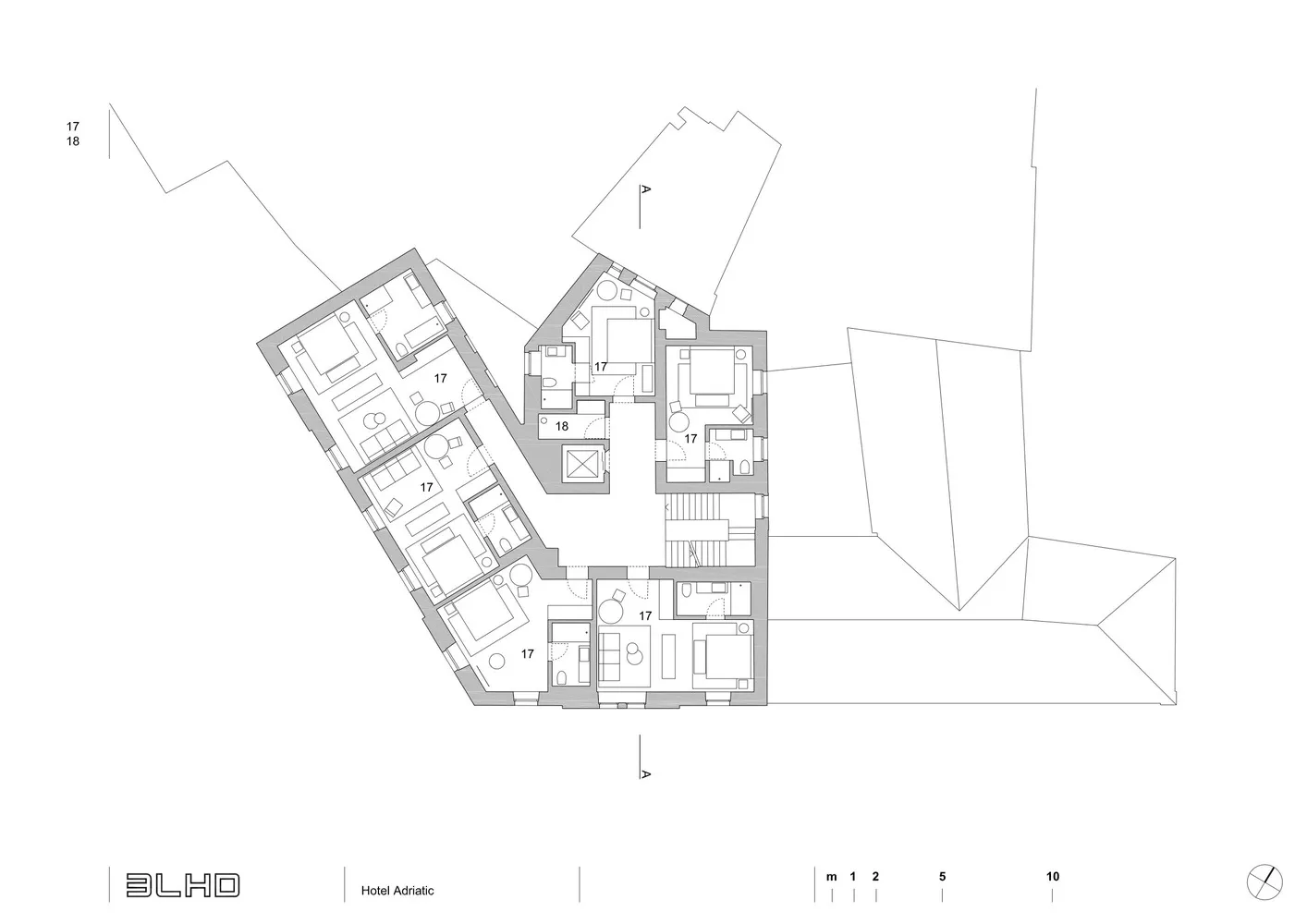 A black and white architectural floor plan of a modern hotel with detailed layout and dimensions.
