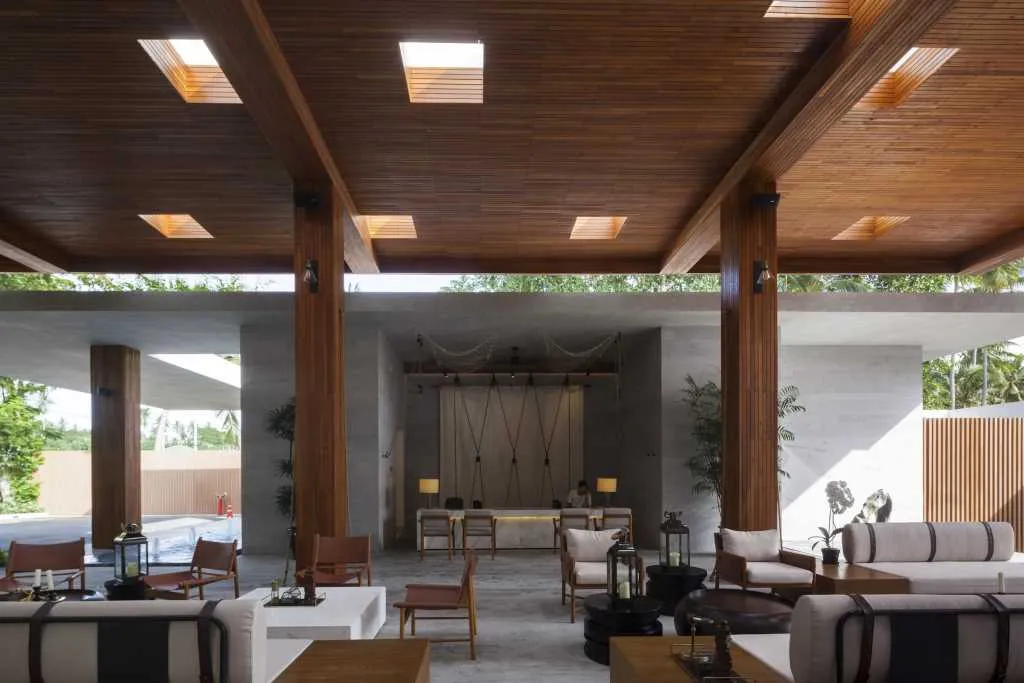 Modern interior design featuring a lobby with a reclaimed wood ceiling and flooring.