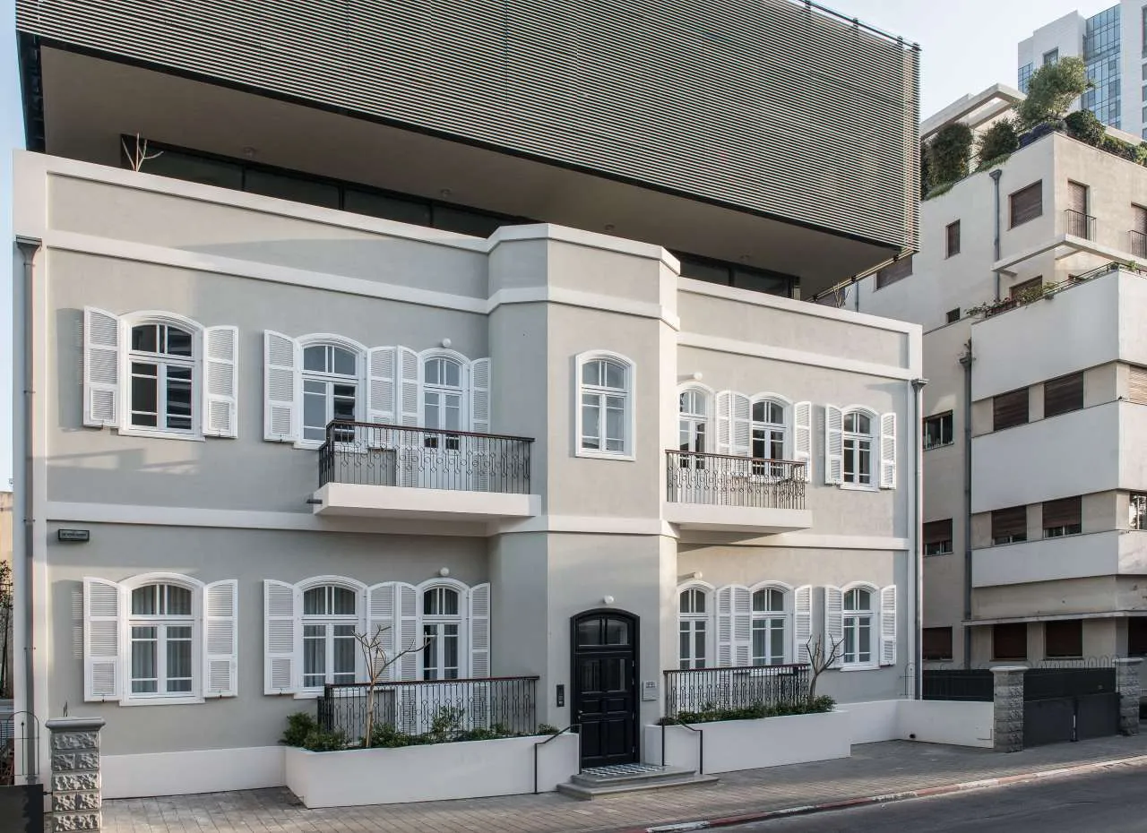 A modern residential building with a concrete exterior.