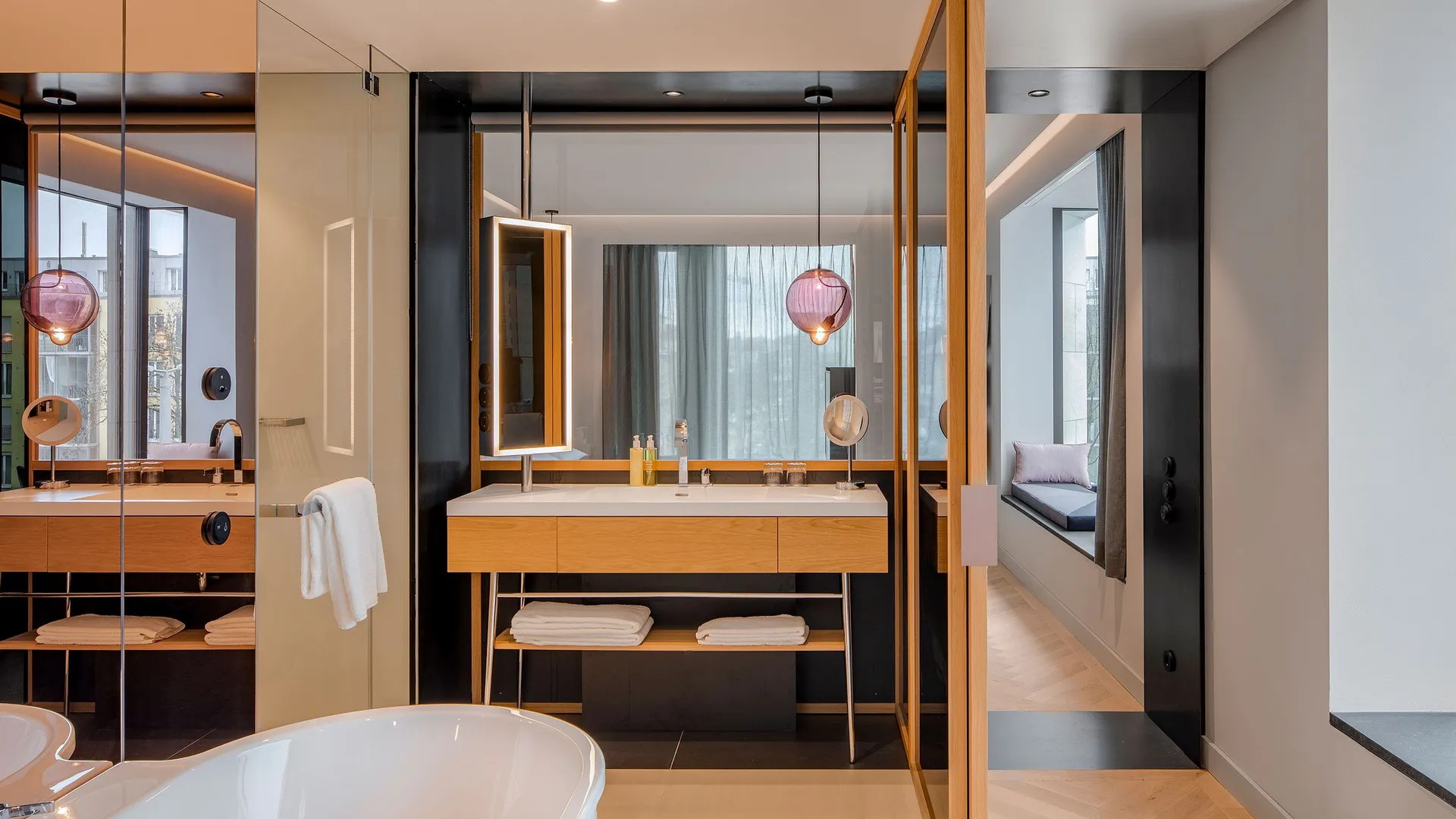 Modern bathroom with wooden furnishings and concrete walls
