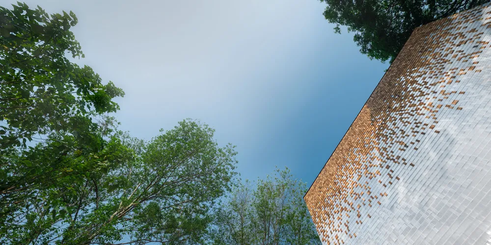 Modern building exterior featuring metal tiles