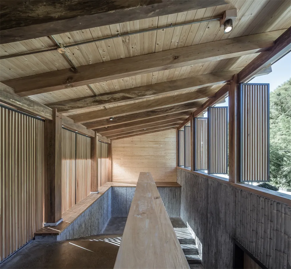 A modern interior space featuring wood paneling walls and ceiling.