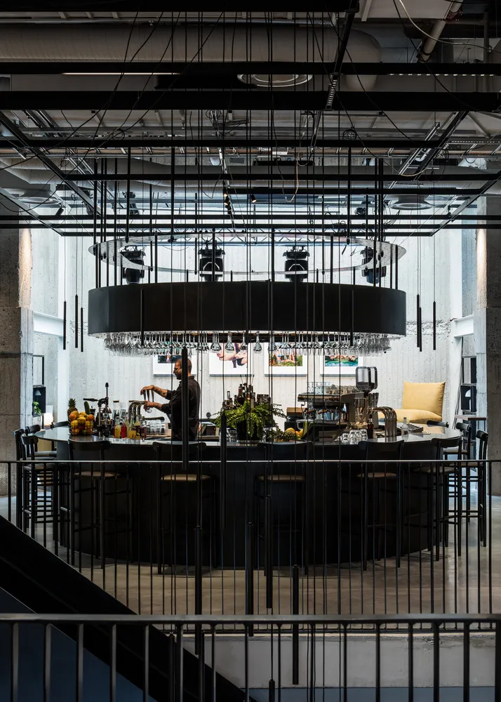 An industrial-style coffee bar featuring concrete materials and a minimalist design.