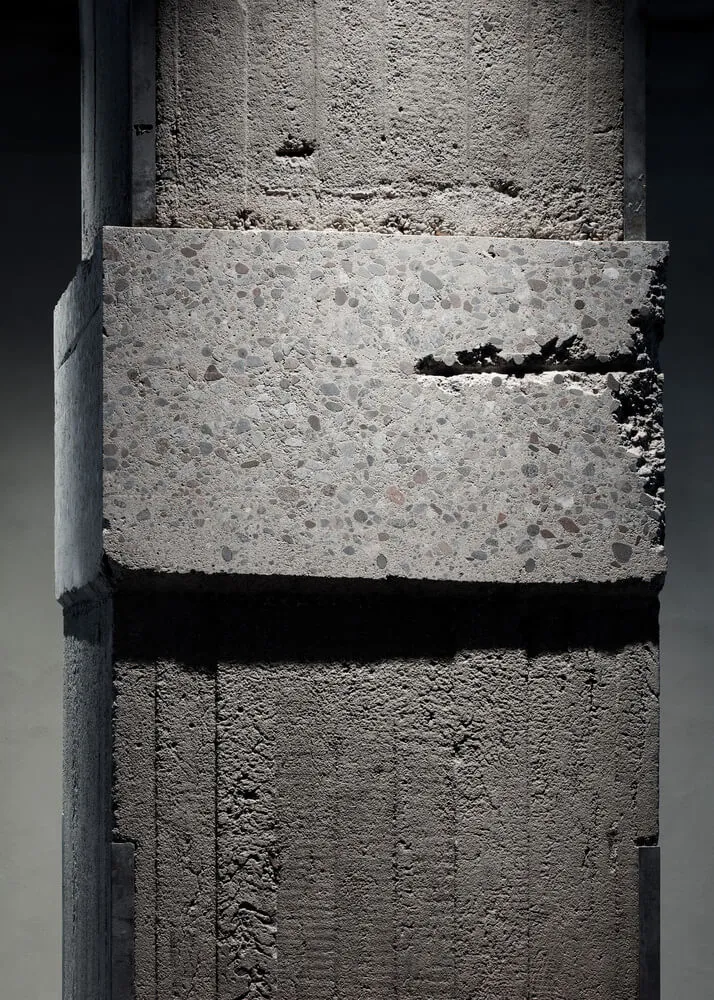 Concrete column with exposed aggregate and rough texture