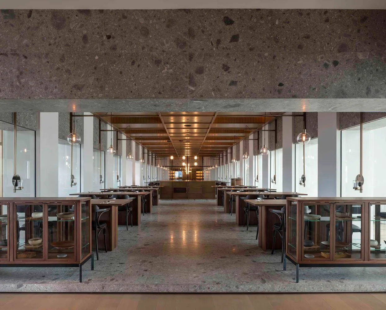 Modern restaurant interior designed with contemporary concrete elements.