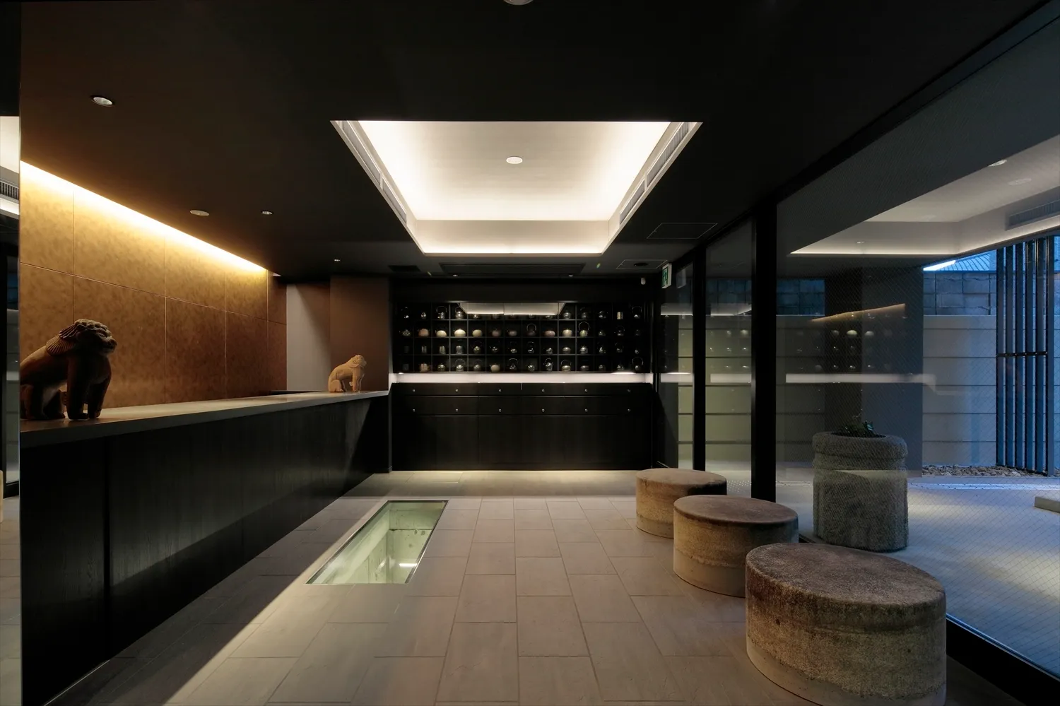 A modern lobby interior featuring a concrete floor and walls.