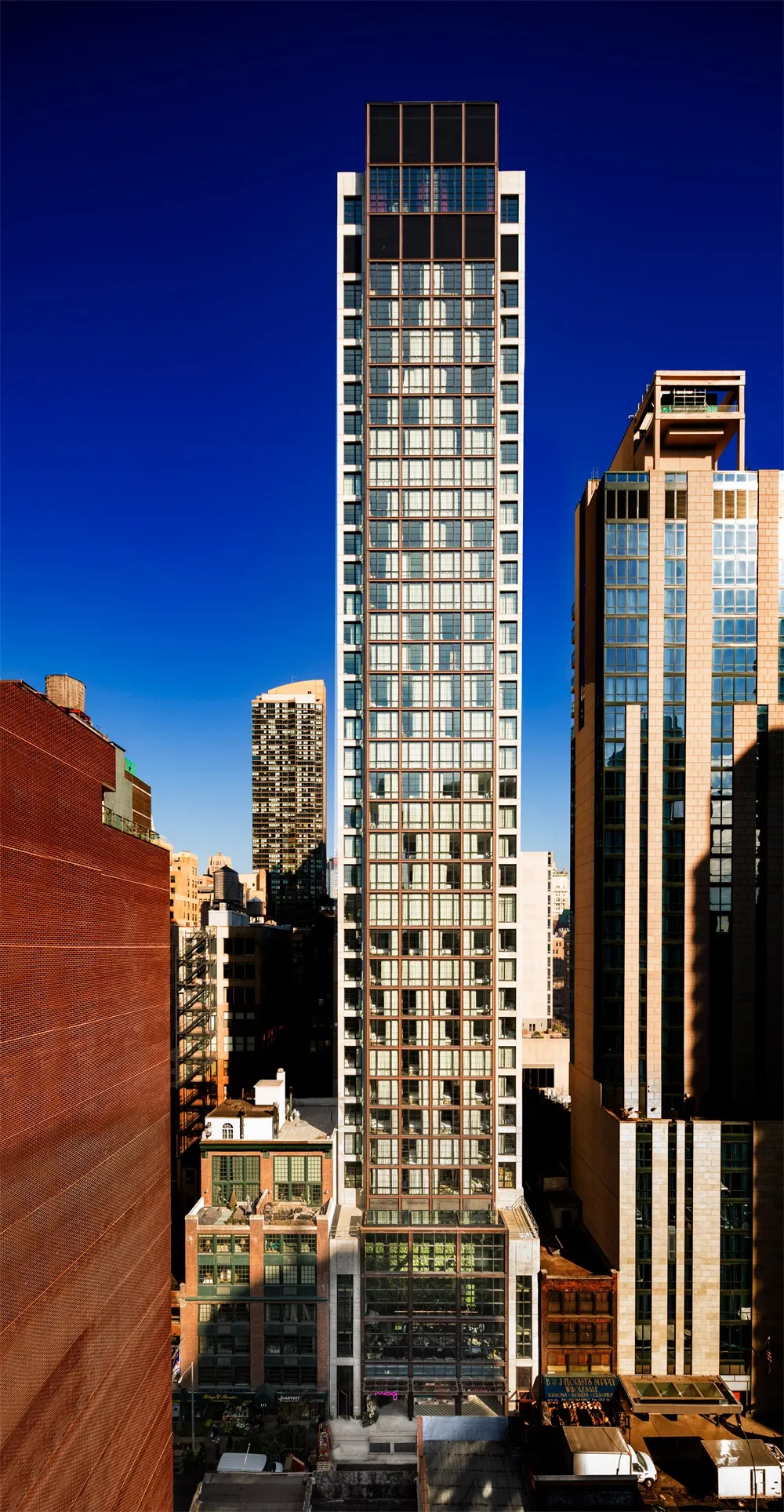 Modern skyscraper with glass facade and dark accents