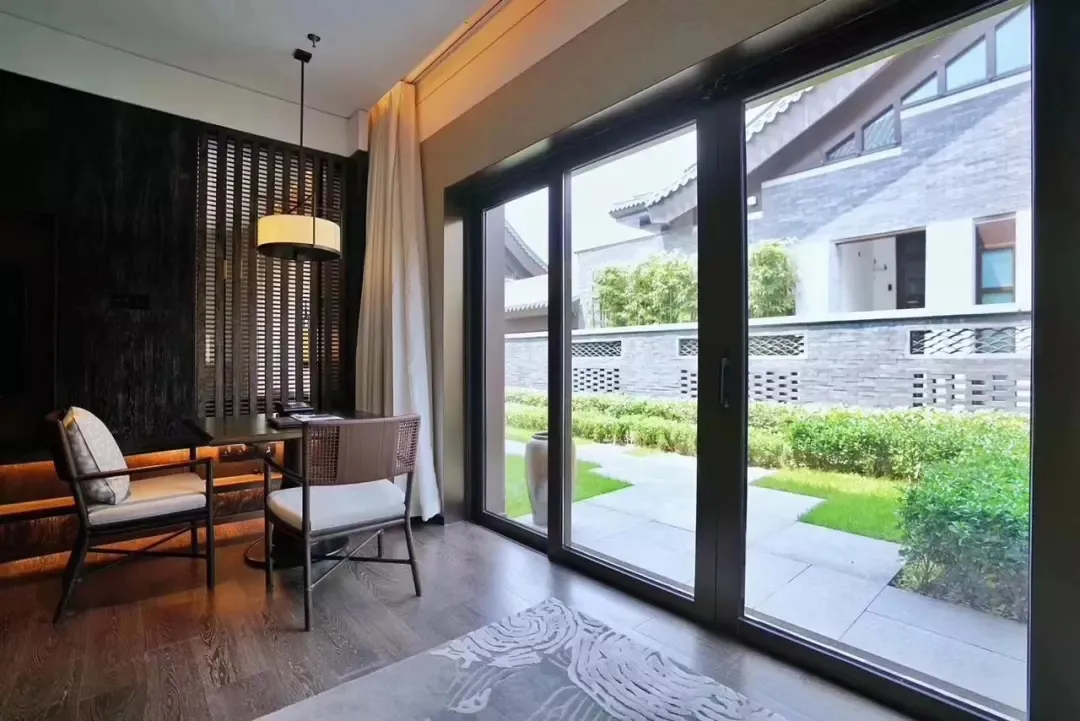 View of a modern office interior featuring a metallic textured floor paneling.
