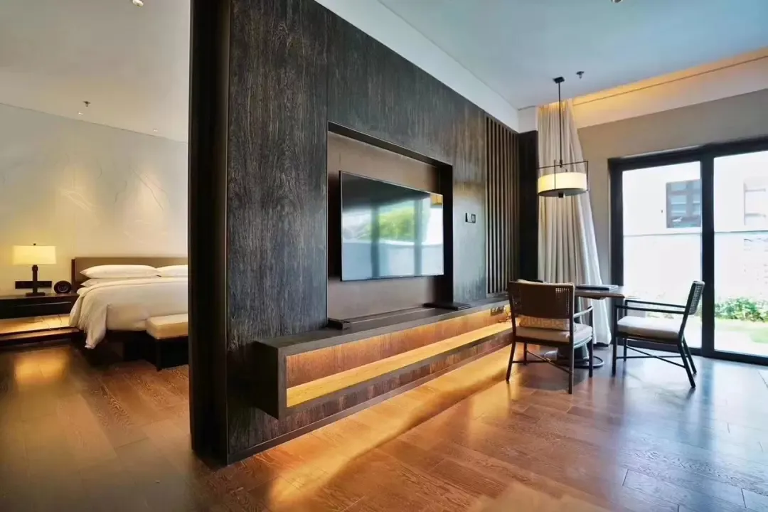 Modern residential suite featuring wooden materials and a contemporary design