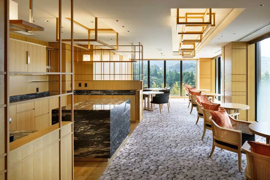 Hotel suite with modern interior design featuring wood and marble elements.