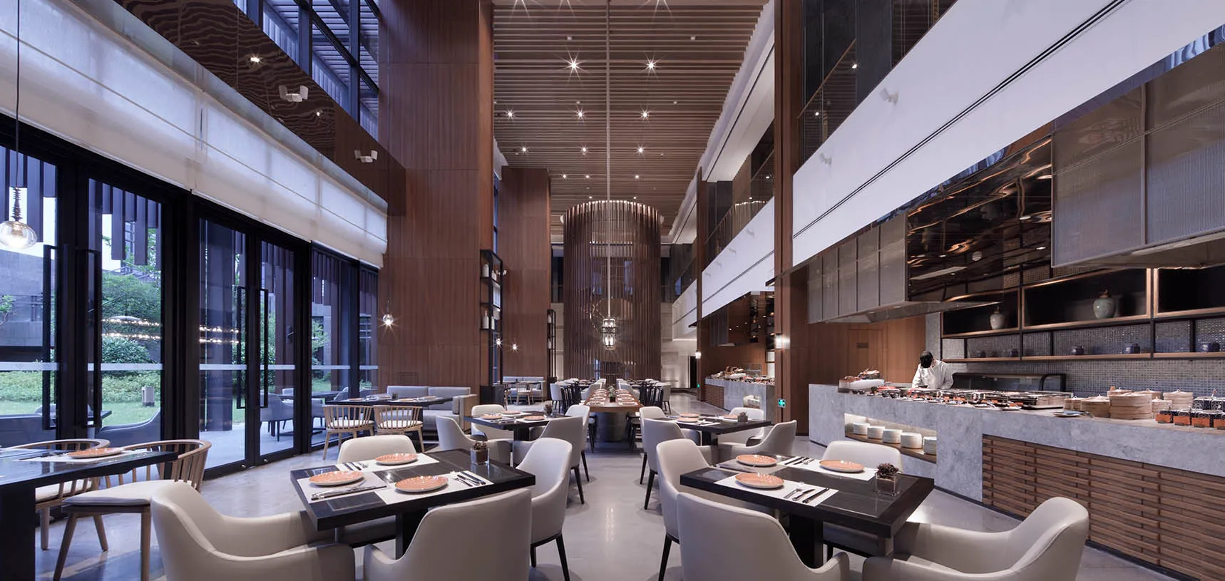 Modern industrial restaurant interior with sleek, minimalist design.