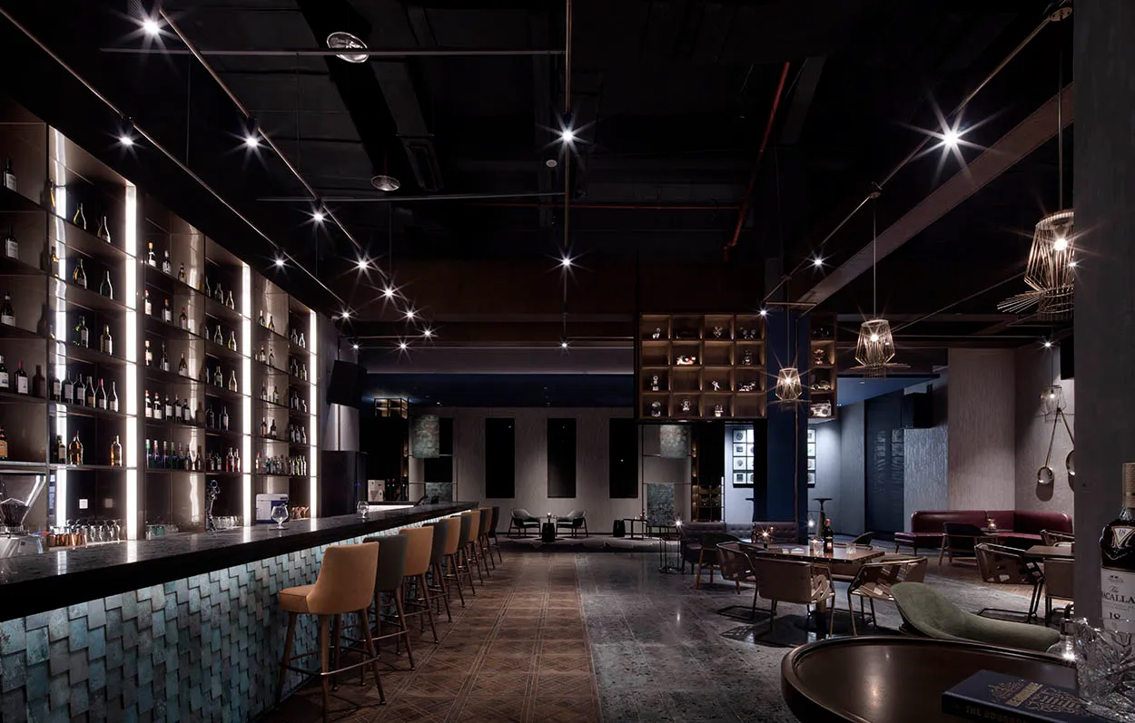 A modern bar featuring metallic elements and sleek design.