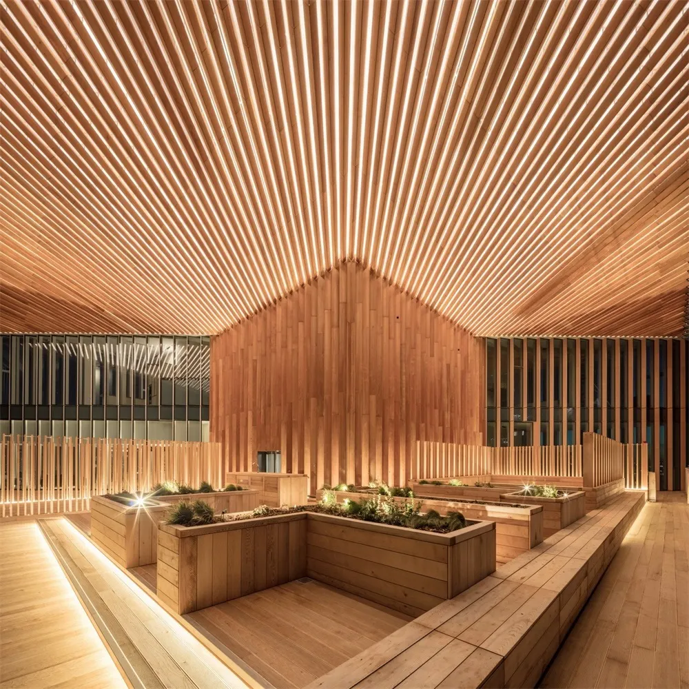 An industrial-style interior space with wooden materials and geometric lighting patterns.