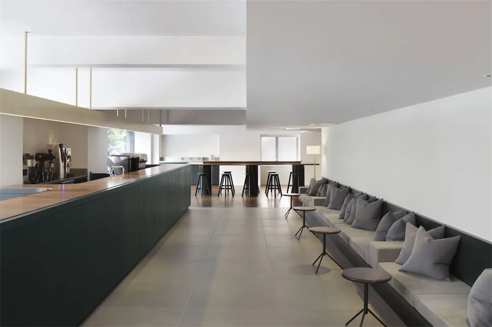 A modern cafe bar and restaurant with mixed-materials and sleek design.