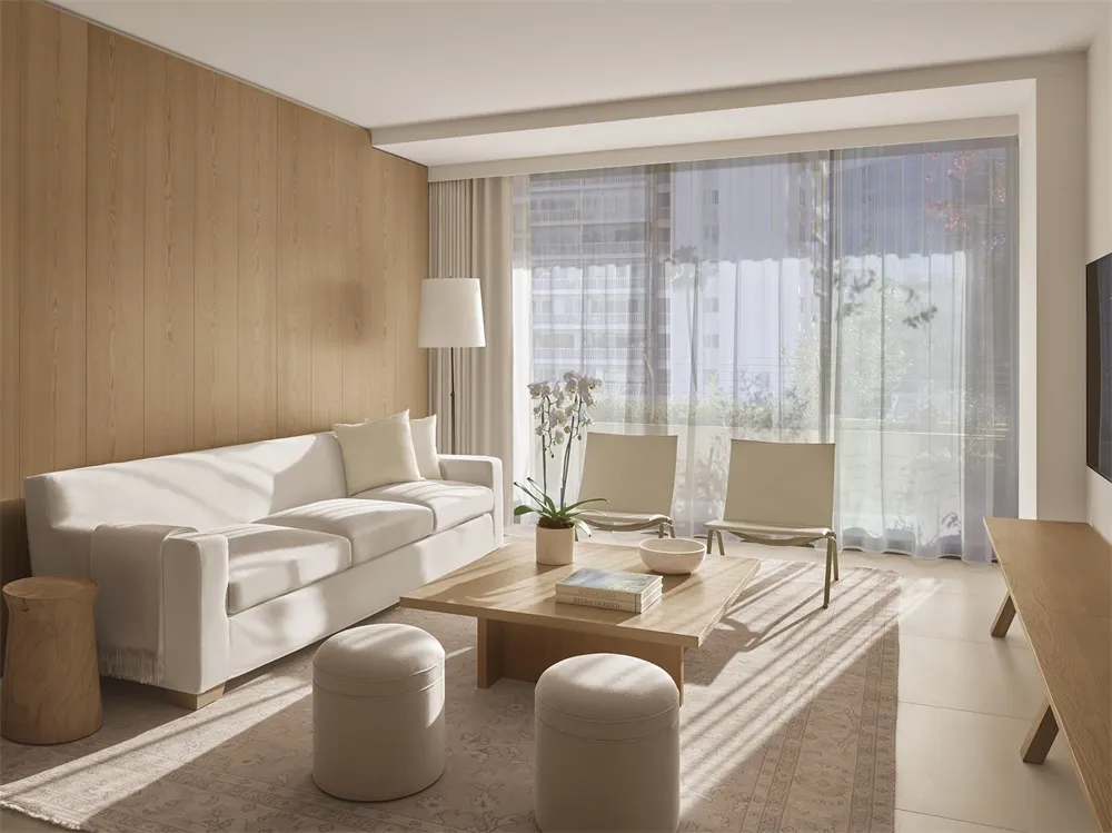 Modern living room with a white sofa, wooden coffee table, and large window.