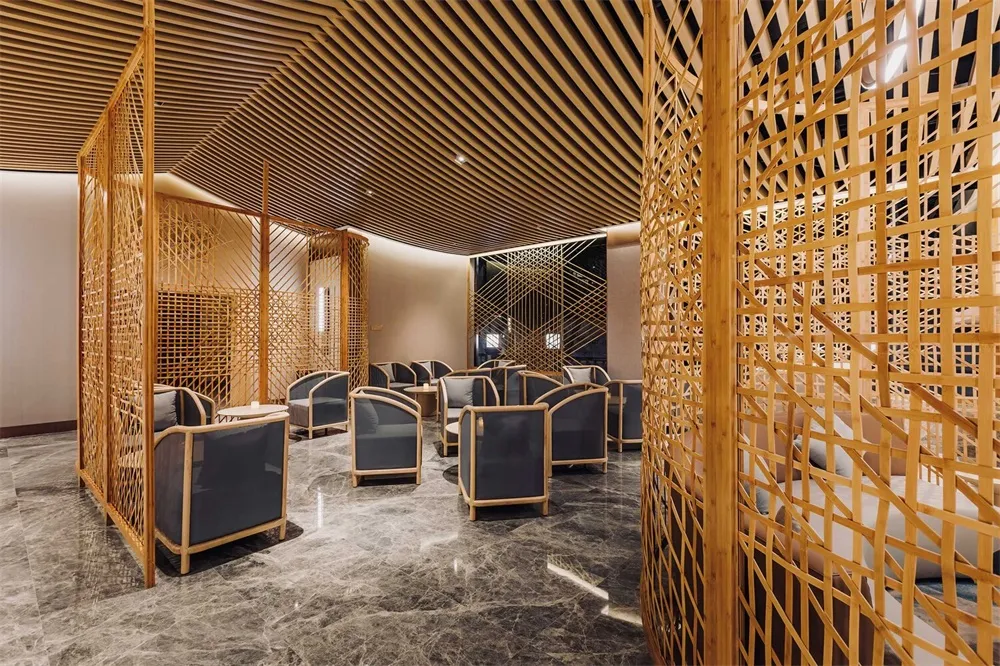 A modern interior lobby featuring wood elements and contemporary furniture.