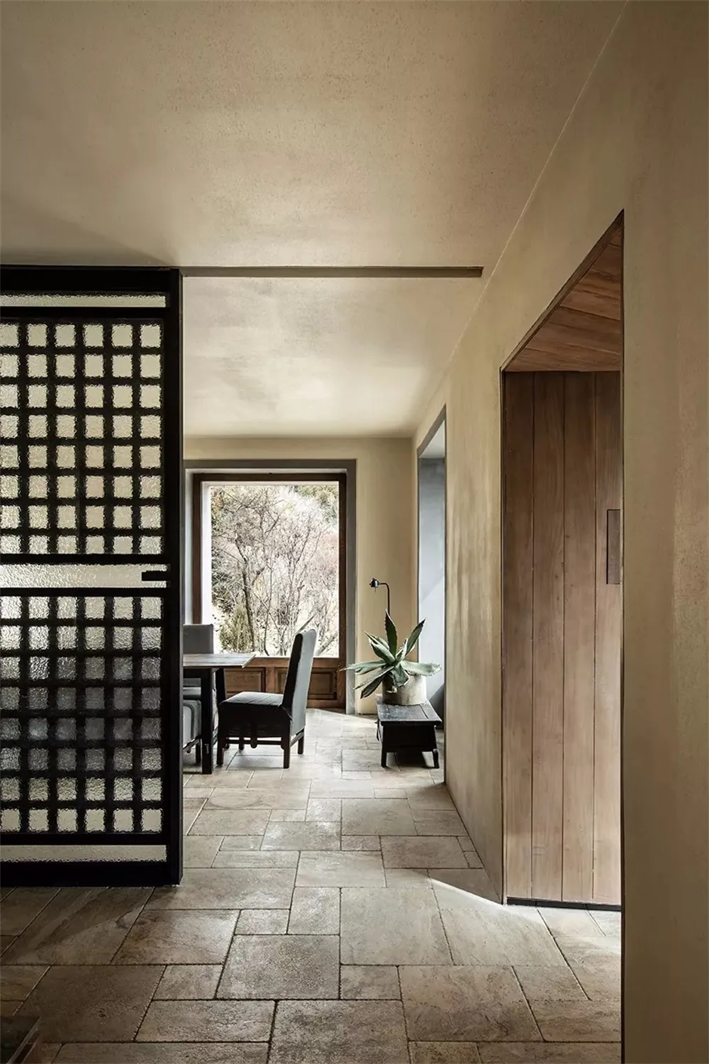 Modern minimalist interior with wooden materials and open layout.