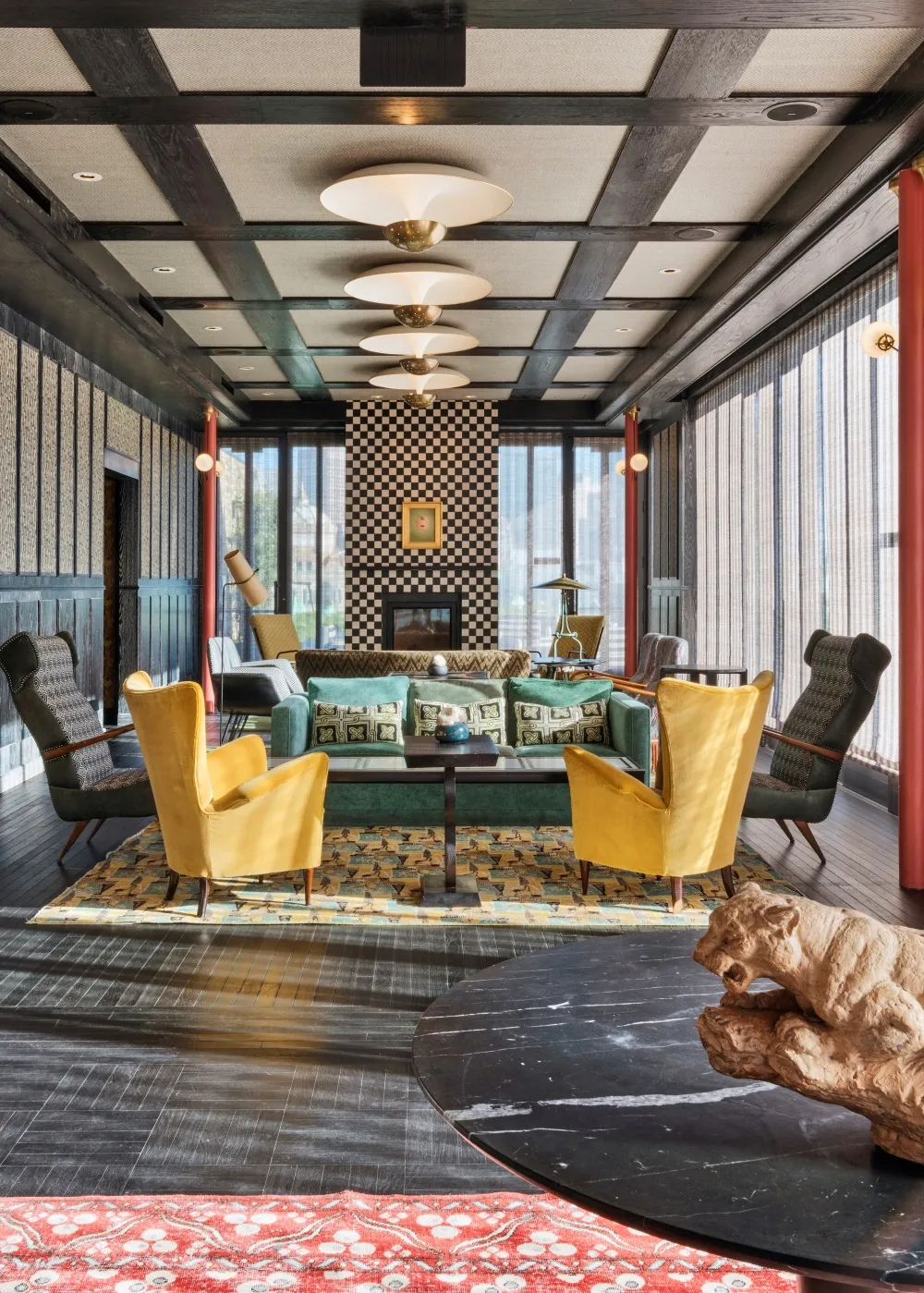 Modern living room featuring wood, fabric, glass, and metal elements.